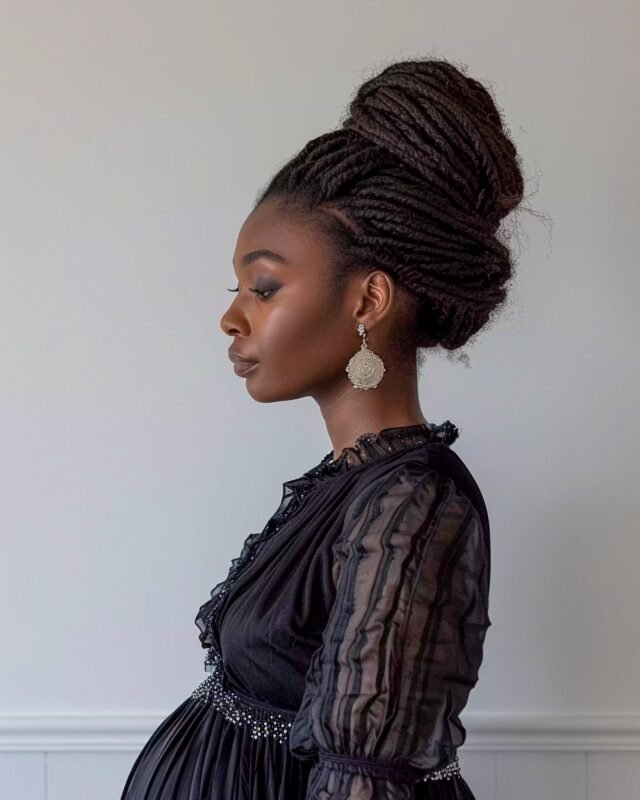 Pregnant woman in black dress, profile portrait